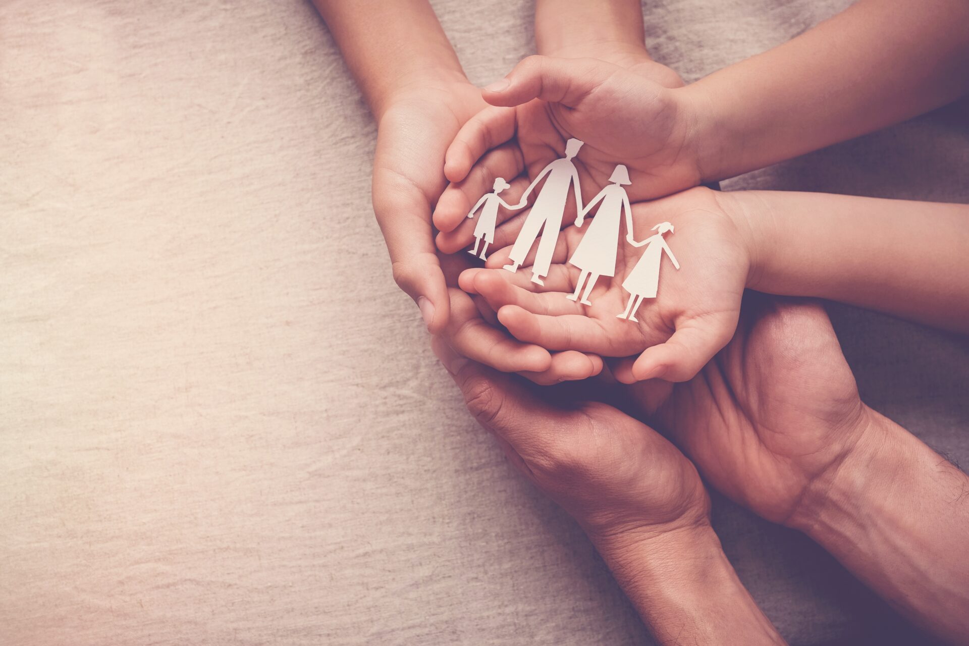 Hands,Holding,Paper,Family,Cutout,,Family,Home,,Foster,Care,,Homeless