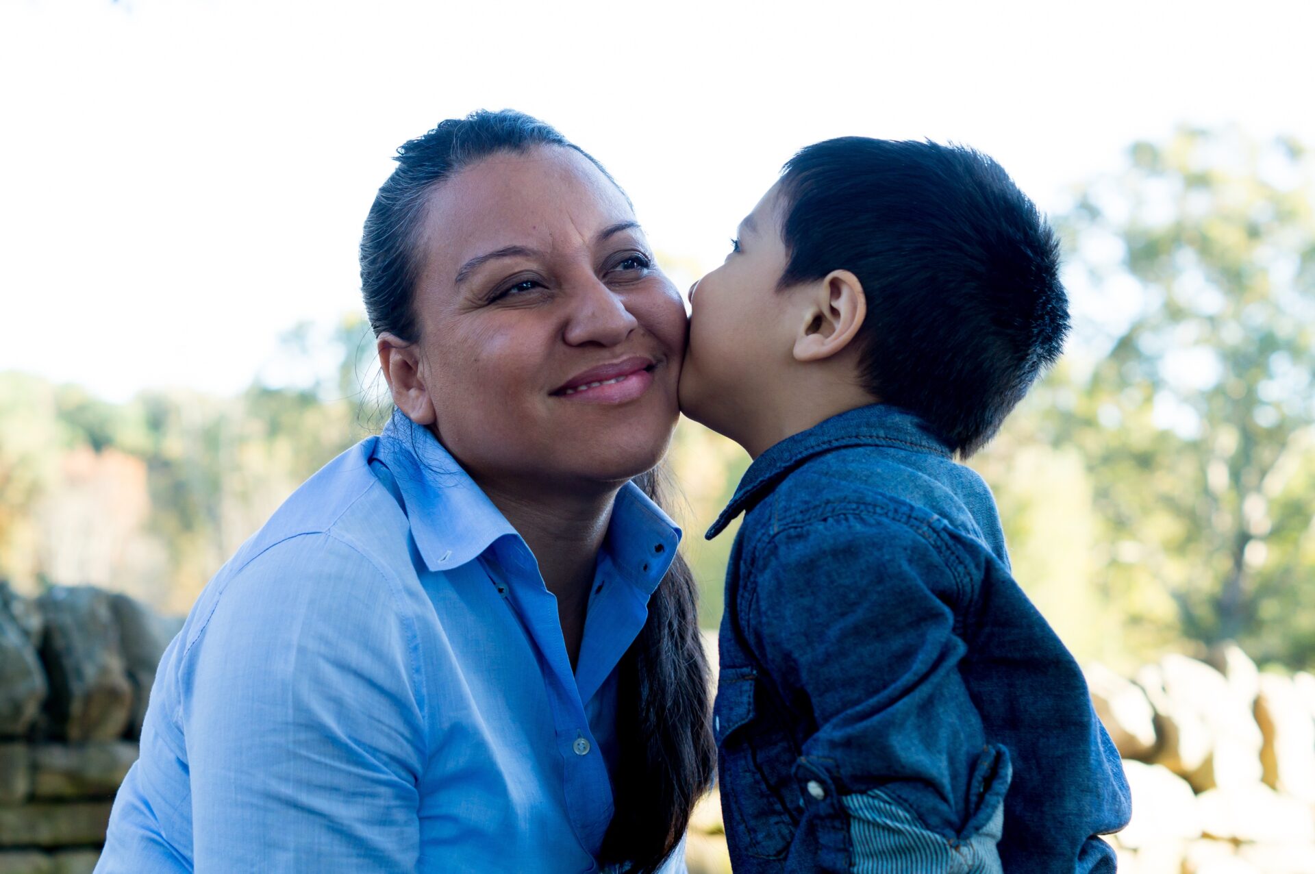 Latino,Son,Giving,A,Kiss,To,His,Mother